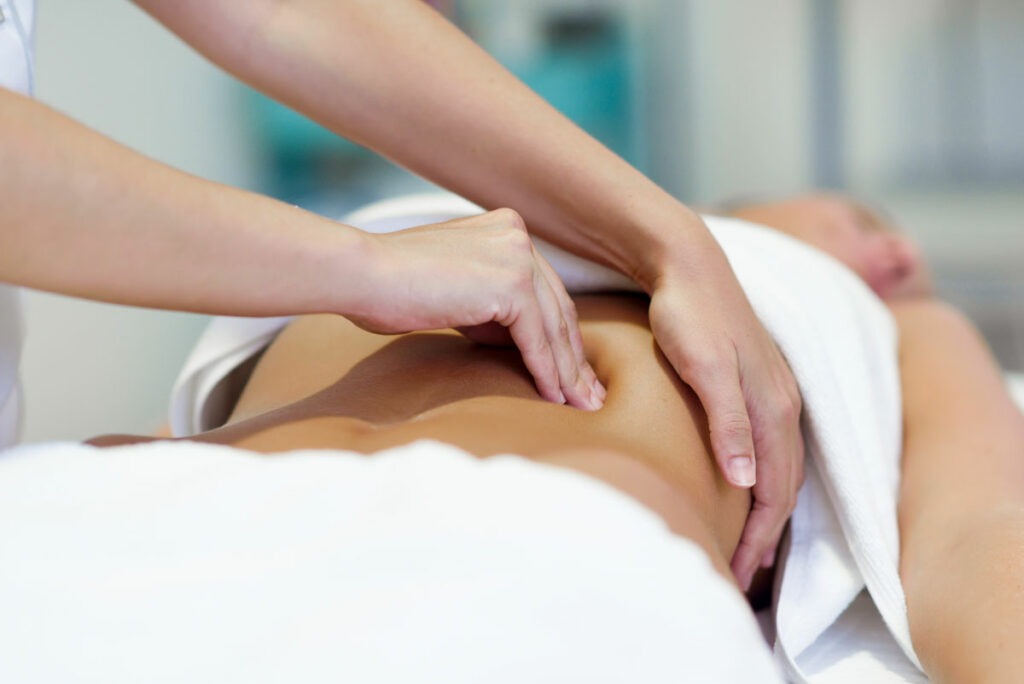 woman having abdomen massage by professional osteo 2021 08 26 20 00 09 utc